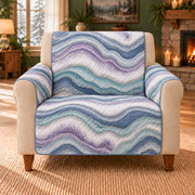Agate Stream Repeat sofa cover on a beige armchair