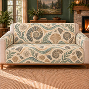 Ancient Shore Mosaic sofa cover on a beige sofa