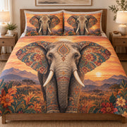 Boho Elephant Sunset Floral quilt set displayed on a bed with coordinating pillow shams