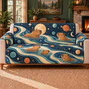 Capybara Cosmic Currents sofa cover on a beige sofa