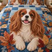 Close-up of Cavalier artwork and diamond stitching on blue autumn patchwork quilt
