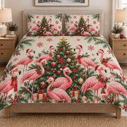 Christmas Flamingo Tropical Holiday quilt set displayed on a bed with coordinating pillow shams