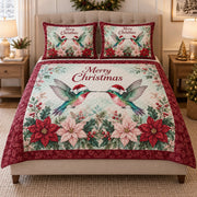 Christmas Hummingbird Poinsettia quilt design with coordinating pillow shams