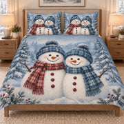 Christmas Snowman Couple Winter quilt set displayed on a bed with coordinating pillow shams