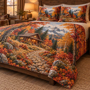 Angled view of autumn cabin path quilt set showing matching pillow shams and side drape