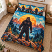 Angled view of Bigfoot sunset lake quilt set with matching Sasquatch shams