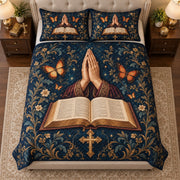 Angled view of prayer hands bible quilt set navy christian bedding gift for faith lovers with matching shams