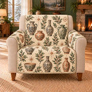Empty Vessel Botanical Toss sofa cover on a beige armchair