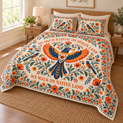 Orange and navy folk art bird floral quilt set, angled view