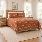 Warm terracotta dachshund and meadow daisy quilt set, left angle view