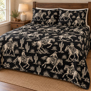 Midnight Ranch Cowboy quilt set, ivory cowboy horse and cactus print on black – hero; AI-styled mockup