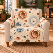 Impact Basin Rosettes sofa cover on a beige armchair