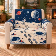 Lunar Footprint Trails sofa cover on a beige armchair