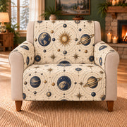 Orrery Orbit Repeat sofa cover on a beige armchair