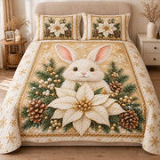 AI mockup, front view of a white bunny behind an ivory poinsettia among pine cones and evergreen branches on cream and gold, quilt and two matching printed pillowcases in a neutral bedroom.