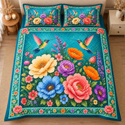 AI mockup, high centered overhead view of large multicolored garden flowers and hovering hummingbirds on bright teal, quilt and two matching printed pillowcases in a neutral bedroom.