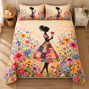 AI mockup, high centered overhead view of a woman in a multicolored patchwork dress and dark hat standing in a bright wildflower garden, quilt and two matching printed pillowcases in a neutral bedroom.