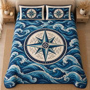 AI mockup, high centered overhead view of a large ivory and teal compass rose amid rolling navy blue ocean waves, quilt and two matching printed pillowcases in a neutral bedroom.