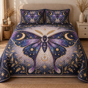 AI mockup, front view of a large purple moth with golden moons and stars over a dark celestial botanical background, quilt and two matching printed pillowcases in a neutral bedroom.