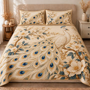 AI mockup, front view of an ivory peacock with blue and gold feather eyes among white blossoms and golden branches, quilt and two matching printed pillowcases in a neutral bedroom.