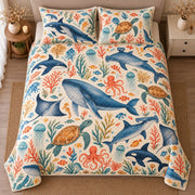 AI mockup, high centered overhead view of blue whales, dolphins, sea turtles, octopuses and coral on ivory, quilt and two matching printed pillowcases in a neutral bedroom.
