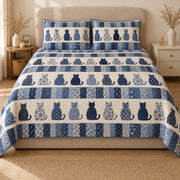 AI mockup, front view of rows of navy and floral cat silhouettes between blue patchwork stripes, quilt and two matching printed pillowcases in a neutral bedroom.