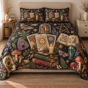 AI mockup, front view of tarot cards, old books, candles, crystals, mushrooms and crescent moons on black, quilt and two matching printed pillowcases in a neutral bedroom.