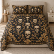 AI mockup, front view of ivory skulls framed by ornate golden botanical scrollwork on black, quilt and two matching printed pillowcases in a neutral bedroom.
