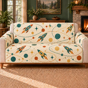 Rocket Orbit Links sofa cover on a beige sofa