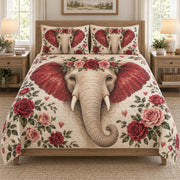 Romantic Elephant Rose Floral quilt set displayed on a bed with coordinating pillow shams