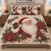 Santa Claus Poinsettia Christmas quilt set displayed on a bed with coordinating pillow shams