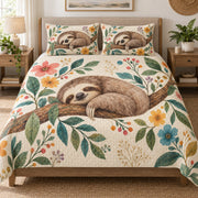 Sleeping Sloth Floral Nature quilt set displayed on a bed with coordinating pillow shams
