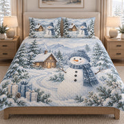 Snowman Cabin Winter Christmas quilt set displayed on a bed with coordinating pillow shams