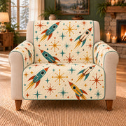 Starburst Rocket Toss sofa cover on a beige armchair