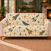 Starburst Rocket Toss sofa cover on a beige sofa