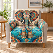 Ornate turquoise floral elephant quilted sofa cover on an armchair, AI-generated product mockup