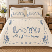 Full front view of unfolded Texas cowgirl icons quilt showing upper border and diamond quilting