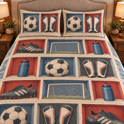 Frontal close-up view AI mockup of the Soccer Equipment Cubes soccer quilt set with two coordinating printed pillow shams.