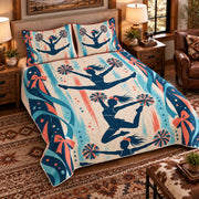 Elevated left-angle view AI mockup of the Cheer Jump Silhouettes competitive cheerleading quilt set with two coordinating printed pillow shams.