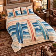 Elevated left-angle view AI mockup of the Surfboard Morning Lineup surfing quilt set with two coordinating printed pillow shams.