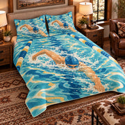Elevated left-angle view AI mockup of the Freestyle Ripple Study competitive swimming quilt set with two coordinating printed pillow shams.