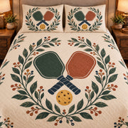 Frontal close-up view AI mockup of the Pickleball Paddle Botanical pickleball quilt set with two coordinating printed pillow shams.