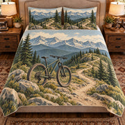 Front view AI mockup of the Trail Bike Ridge mountain biking quilt set with two coordinating printed pillow shams.