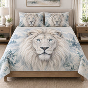 White Lion Blue Eyes quilt set displayed on a bed with coordinating pillow shams