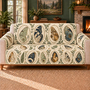 Wing Detail Ovals sofa cover on a beige sofa